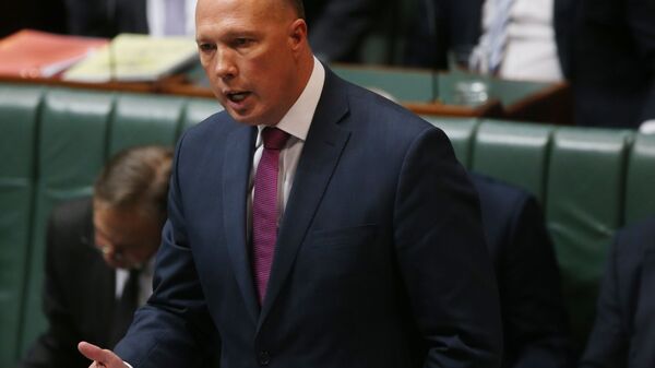 In this Wednesday, July 24, 2019, photo, Australian Home Affairs Minister Peter Dutton addresses Parliament House in Canberra - Sputnik International