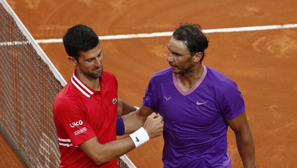 Tennis - ATP Masters 1000 - Italian Open - Foro Italico, Rome, Italy - May 16, 2021 Spain's Rafael Nadal shakes hands with Serbia's Novak Djokovic after winning the final - Sputnik International