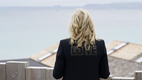 First lady Jill Biden turns around to show the word love on the back of her jacket as she speaks with reporters after visiting with Carrie Johnson, wife of British Prime Minister Boris Johnson, ahead of the G-7 summit, Thursday, June 10, 2021, in Carbis Bay, England. - Sputnik International