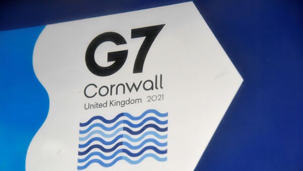 A G7 logo is seen on an information sign near the Carbis Bay hotel resort, where an in-person G7 summit of global leaders is due to take place in June, St Ives, Cornwall, southwest Britain May 24, 2021. Picture taken May 24, 2021 - Sputnik International
