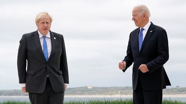 British Prime Minister Boris Johnson and U.S. President Joe Biden pose for photos at the G-7 summit, in Carbis Bay, Cornwall, Britain June 11, 2021 - Sputnik International