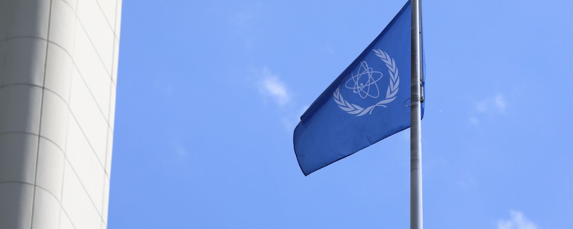 The flag of the International Atomic Energy Agency, IAEA waves at the entrance of the Vienna International Center in Vienna, Austria, Monday, June 7, 2021. - Sputnik International, 1920, 12.11.2022