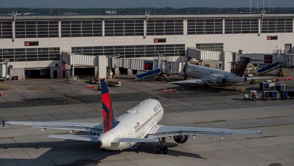 Delta Airlines passenger jets are docked at Detroit Metropolitan Wayne County Airport in Detroit, Michigan, U.S. June 12, 2021. - Sputnik International