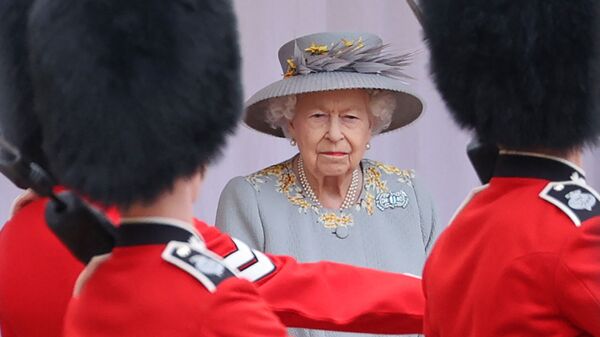 Britain's Queen Elizabeth II watches a military ceremony to mark her official birthday at Windsor Castle on June 12, 2021 in Windsor. - Sputnik International