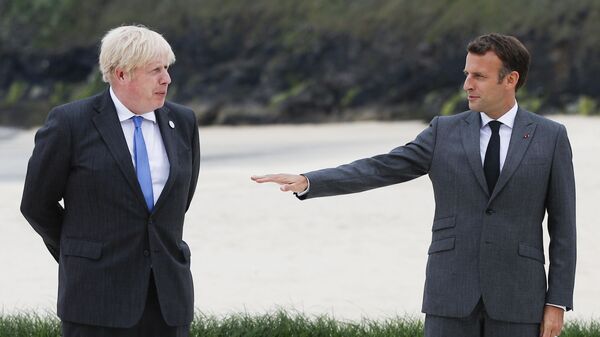 British Prime Minister Boris Johnson, left, speaks with French President Emmanuel Macron during arrivals for the G7 meeting at the Carbis Bay Hotel in Carbis Bay, St. Ives, Cornwall, England - Sputnik International
