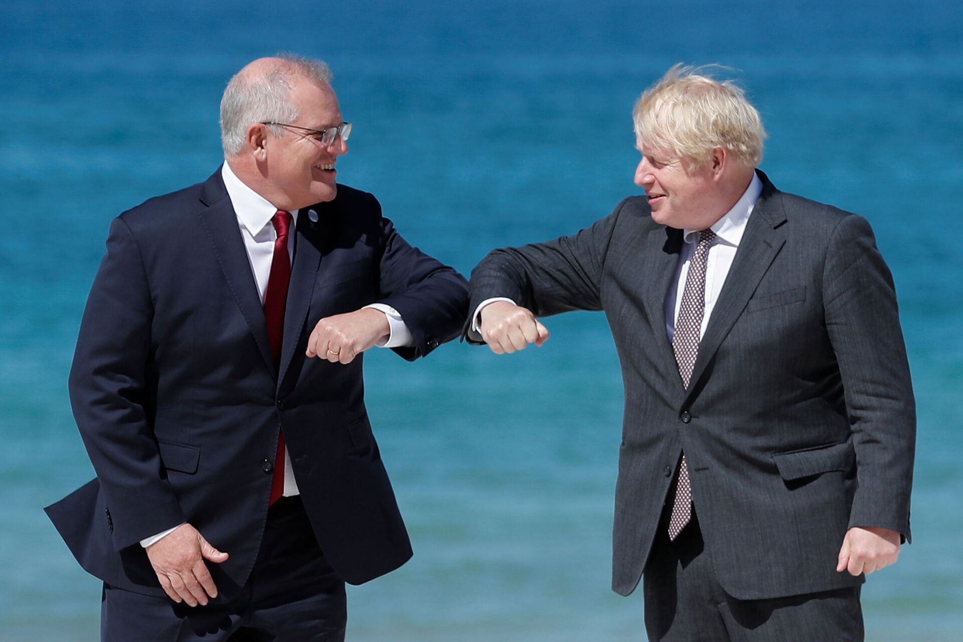 Britain's Prime Minister Boris Johnson greets Australia's Prime Minister Scott Morrison during an official welcome at the G7 summit in Carbis Bay, Cornwall, Britain, June 12, 2021.  - Sputnik International, 1920, 07.09.2021