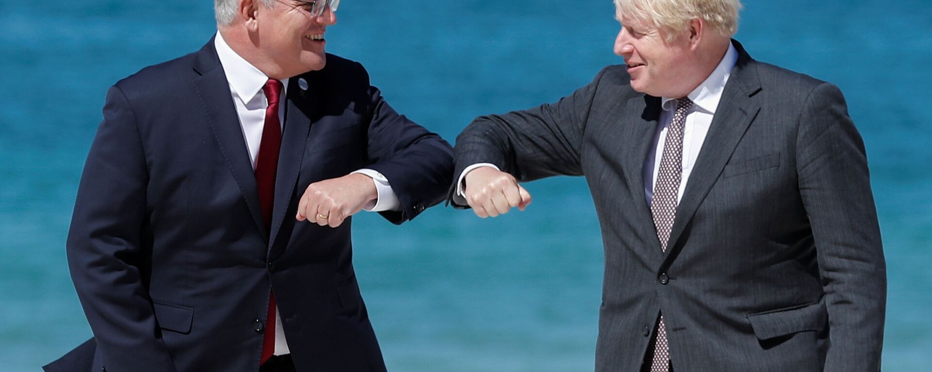 Britain's Prime Minister Boris Johnson greets Australia's Prime Minister Scott Morrison during an official welcome at the G7 summit in Carbis Bay, Cornwall, Britain, June 12, 2021.  - Sputnik International, 1920, 20.01.2022