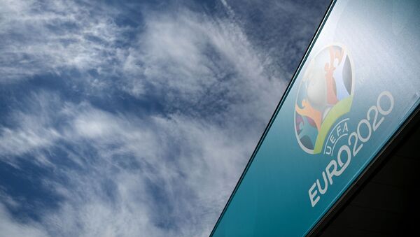 The UEFA EURO 2020 logo is pictured in front of the Saint Petersburg Stadium, one of the host venues for the UEFA EURO 2020 football tournament, in Saint Petersburg on June 9, 2021. - The European championship, which was delayed from last year due to the coronavirus pandemic, is set to take place across between June 11 and July 11, 2021. - Sputnik International