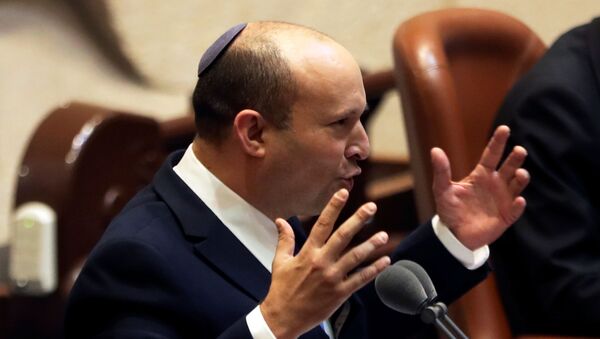 Naftali Bennett, Prime Minister-designate, gestures as he speaks at the Knesset, Israel's parliament, during a special session whereby a confidence vote will be held to approve and swear-in a new coalition government, in Jerusalem June 13, 2021. - Sputnik International
