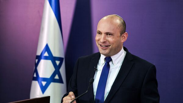 Naftali Bennett, Israeli parliament member from the Yamina party, gives a statement at the Knesset, Israel's parliament, in Jerusalem on June 6, 2021. - In power for 12 consecutive years, Israel's embattled Prime Minister Benjamin Netanyahu faces being toppled by a motley coalition of lawmakers united only by their shared hostility towards him. Under the agreement, the right-wing nationalist Bennett would be premier for two years, to be replaced by the centrist Yair Lapid of the Yesh Atid party in 2023. - Sputnik International