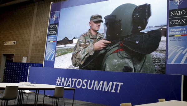 NATO troops are shown on a large screen in an empty press room at NATO headquarters prior to a NATO summit in Brussels, Sunday, June 13, 2021. - Sputnik International
