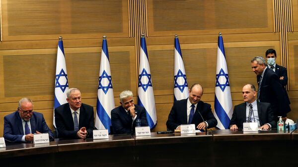 Israeli Prime Minister Naftali Bennett and some of his government attend its first cabinet meeting in the Knesset, Israel's parliament, in Jerusalem June 13, 2021. - Sputnik International