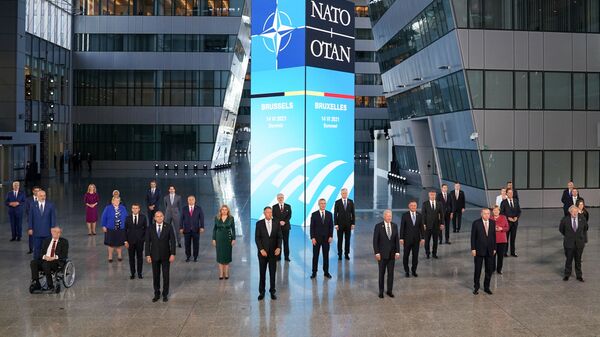 US President Joe Biden and other NATO heads of the states and governments pose for a family photo during the NATO summit at the Alliance's headquarters, in Brussels, Belgium, 14 June 2021. REUTERS/Kevin Lamarque/Pool - Sputnik International
