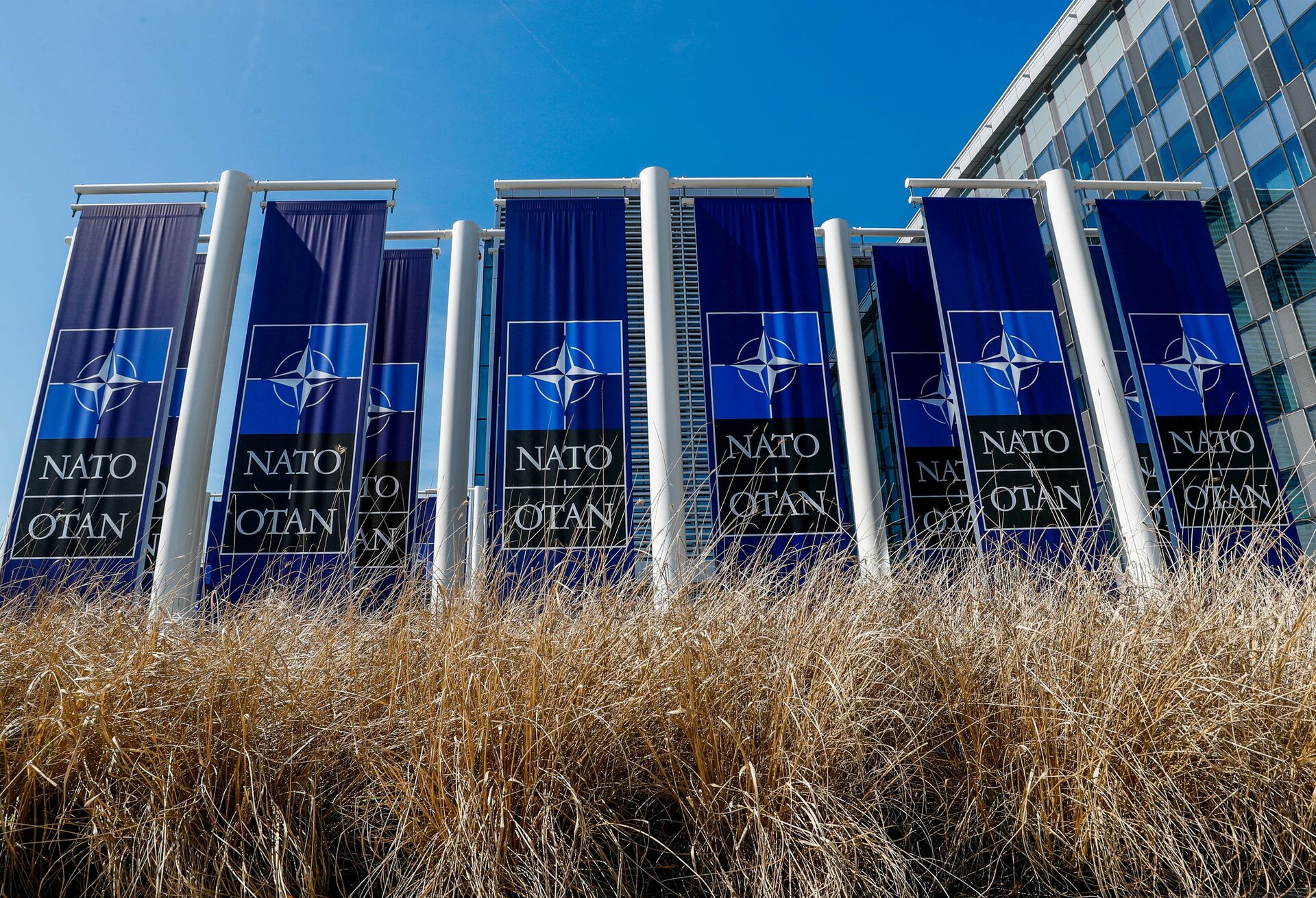FILE PHOTO: Banners displaying the NATO logo are placed at the entrance of new NATO headquarters during the move to the new building, in Brussels, Belgium April 19, 2018.  REUTERS/Yves Herman/File Photo - Sputnik International, 1920, 09.04.2022