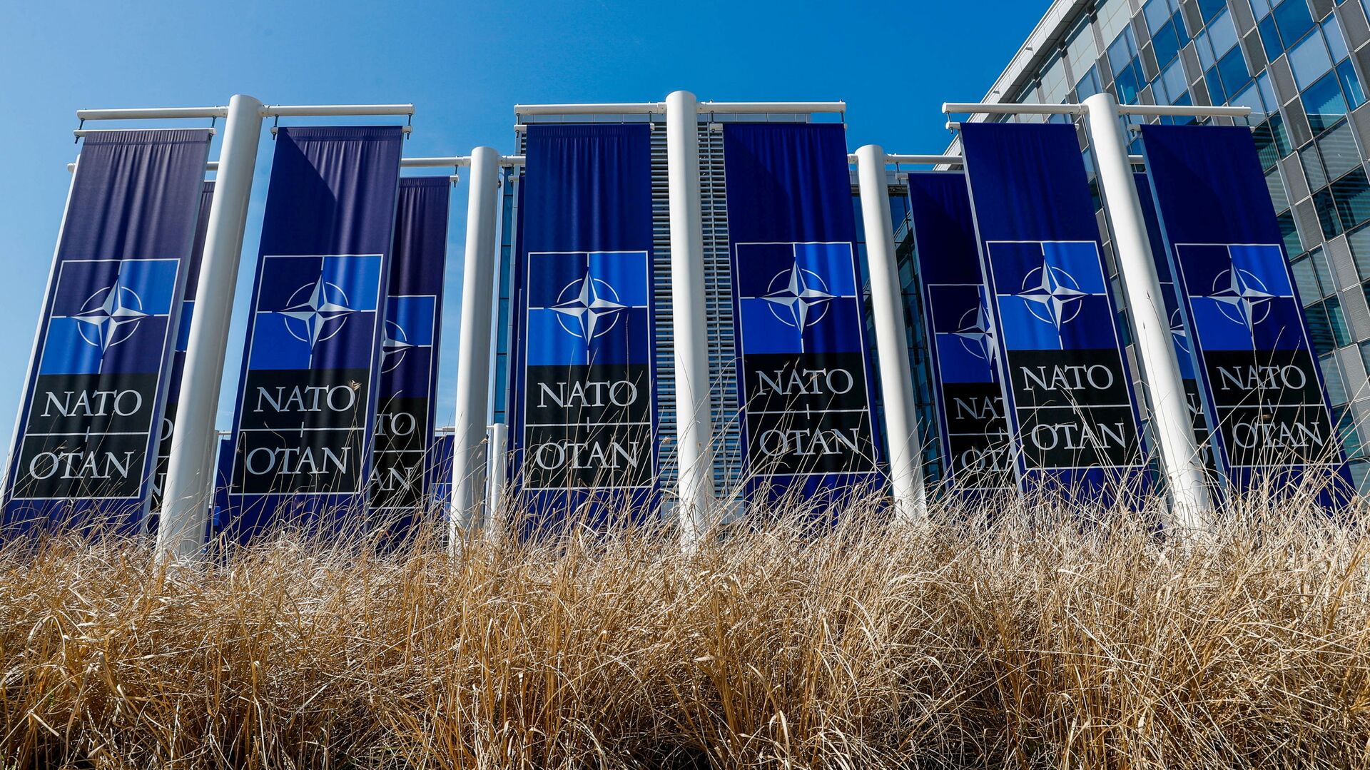 FILE PHOTO: Banners displaying the NATO logo are placed at the entrance of new NATO headquarters during the move to the new building, in Brussels, Belgium April 19, 2018.  REUTERS/Yves Herman/File Photo - Sputnik International, 1920, 06.09.2021