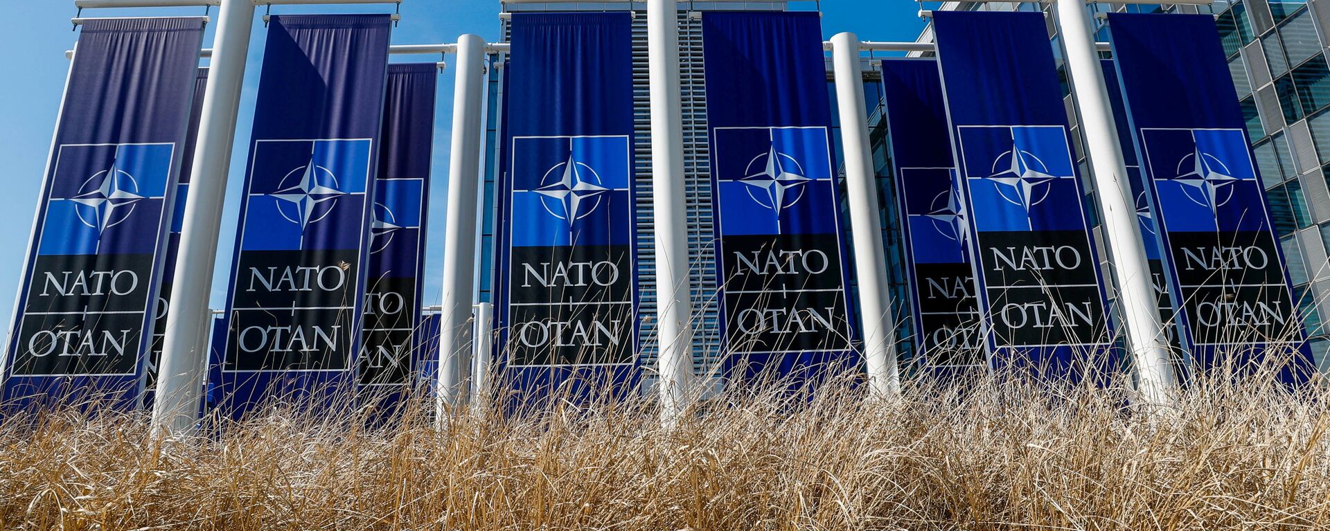 FILE PHOTO: Banners displaying the NATO logo are placed at the entrance of new NATO headquarters during the move to the new building, in Brussels, Belgium April 19, 2018.  REUTERS/Yves Herman/File Photo - Sputnik International, 1920, 14.06.2021