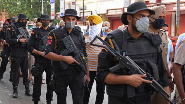 Police commandos patrol through a market area ahead of the 37th anniversary of Operation Blue Star in Amritsar on June 3, 2021.  - Sputnik International