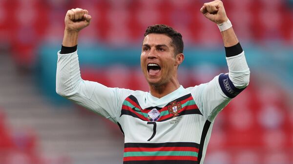Soccer Football - Euro 2020 - Group F - Hungary v Portugal - Puskas Arena, Budapest, Hungary - June 15, 2021 Portugal's Cristiano Ronaldo celebrates scoring their third goal - Sputnik International