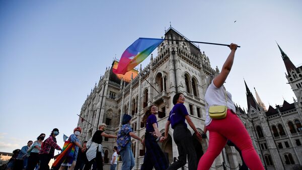 Demonstrators march as they protest against Hungarian Prime Minister Viktor Orban and the latest anti-LGBTQ law in Budapest, Hungary, June 14, 2021 - Sputnik International