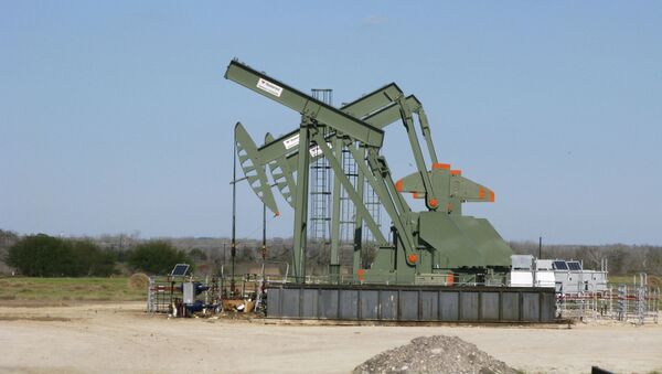 A pump jack used to help lift crude oil from a well in South Texas - Sputnik International