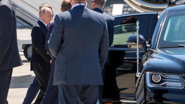 Russian President Vladimir Putin walks after stepping down from an airplane ahead of U.S. - Russia summit, on Geneva Airport Cointrin, Switzerland, Wednesday, June 16, 2021 - Sputnik International