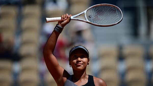 In this file photo taken on May 30, 2021, Japan's Naomi Osaka celebrates after winning against Romania's Patricia Maria Tig during their women's singles first round tennis match on Day 1 of The Roland Garros 2021 French Open tennis tournament in Paris. - Japanese star Naomi Osaka has withdrawn from Wimbledon, her agent confirmed on June 17, 2021, weeks after the world number two pulled out of the French Open citing her struggle with depression and anxiety. - Sputnik International