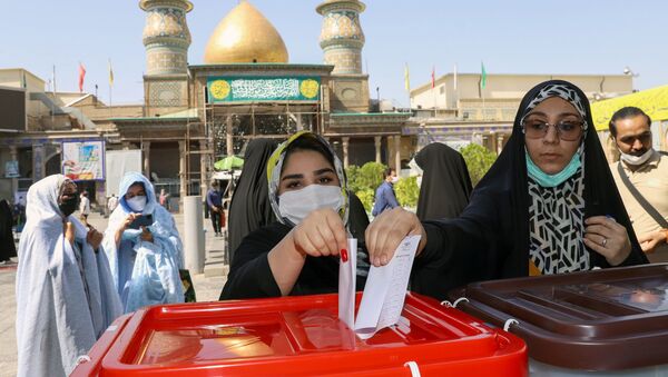 Iranian women cast their vote during presidential elections at a polling station in Tehran, Iran, 18 June 2021 - Sputnik International