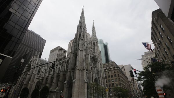 Pedestrians pass St Patrick's Cathedral Wednesday, July 8, 2020, in New York. - Sputnik International