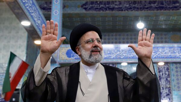 Presidential candidate Ebrahim Raisi gestures after casting his vote during presidential elections at a polling station in Tehran, Iran June 18, 2021. Majid Asgaripour/WANA (West Asia News Agency) - Sputnik International