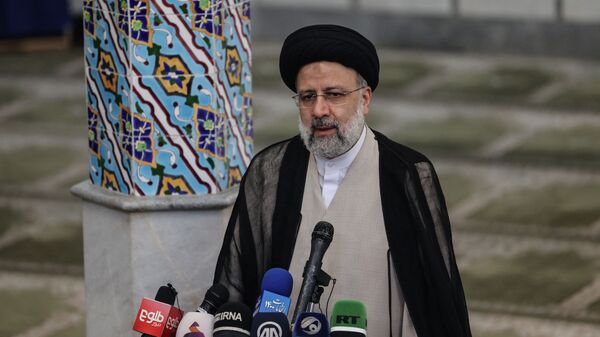 Ebrahim Raisi gives a news conference after voting in the presidential election, at a polling station in the capital Tehran, on 18 June 2021. - Raisi was declared the winner of a presidential election on 19 June, a widely anticipated result after many political heavyweights were barred from running. - Sputnik International