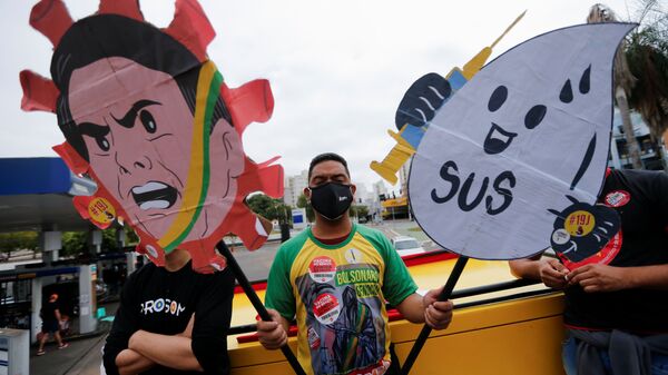 People participate in a protest against Brazil's President Jair Bolsonaro and his handling of the coronavirus disease (COVID-19) pandemic in Cuiaba, Brazil, June 19, 2021.  - Sputnik International