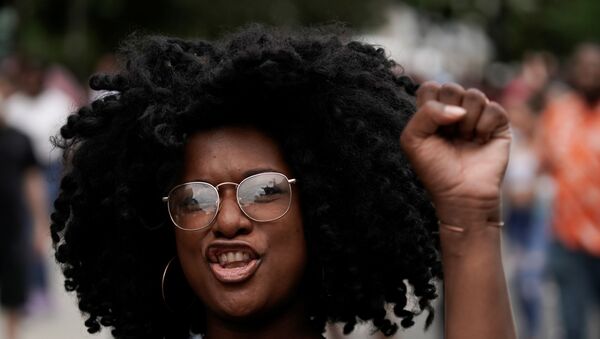 Alison Lane gestures as she celebrates Juneteenth, which commemorates the end of slavery in Texas, two years after the 1863 Emancipation Proclamation freed slaves elsewhere in the United States, in Washington, D.C. U.S., June 19, 2021.  - Sputnik International
