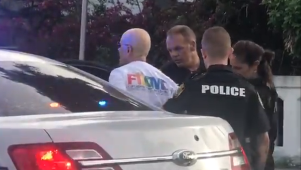 Screenshot from a video allegedly filmed at a Stonewall pride march in Florida's Wilton Manors, showing police officers arresting a purported suspect who drove a truck into the crowd - Sputnik International