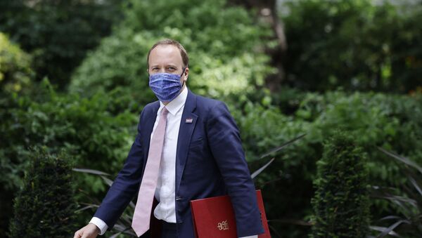 Britain's Health Secretary Matt Hancock walks along Downing Street in central London on June 15, 2021 - Sputnik International