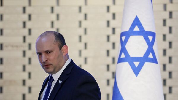Israeli Prime Minister Naftali Bennett attends a memorial ceremony for soldiers who fell in the 2014 war with Gaza, at the Hall of Remembrance of Mount Herzl military cemetery in Jerusalem June 20, 2021 - Sputnik International