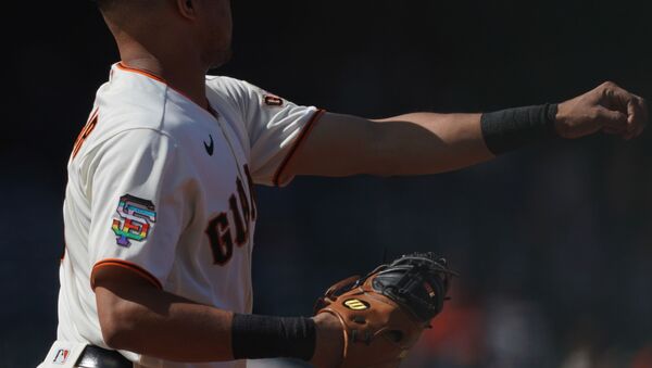 Jun 5, 2021; San Francisco, California, USA; San Francisco Giants first baseman LaMonte Wade Jr (31) warms up with a logo promoting LBGTQ+ pride on his uniform before the game against the Chicago Cubs at Oracle Park. - Sputnik International