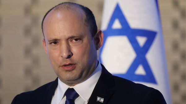Israeli Prime Minister Naftali Bennett speaks during a memorial ceremony for soldiers who fell in the 2014 war with Gaza, at the Hall of Remembrance of Mount Herzl military cemetery in Jerusalem June 20, 2021 - Sputnik International