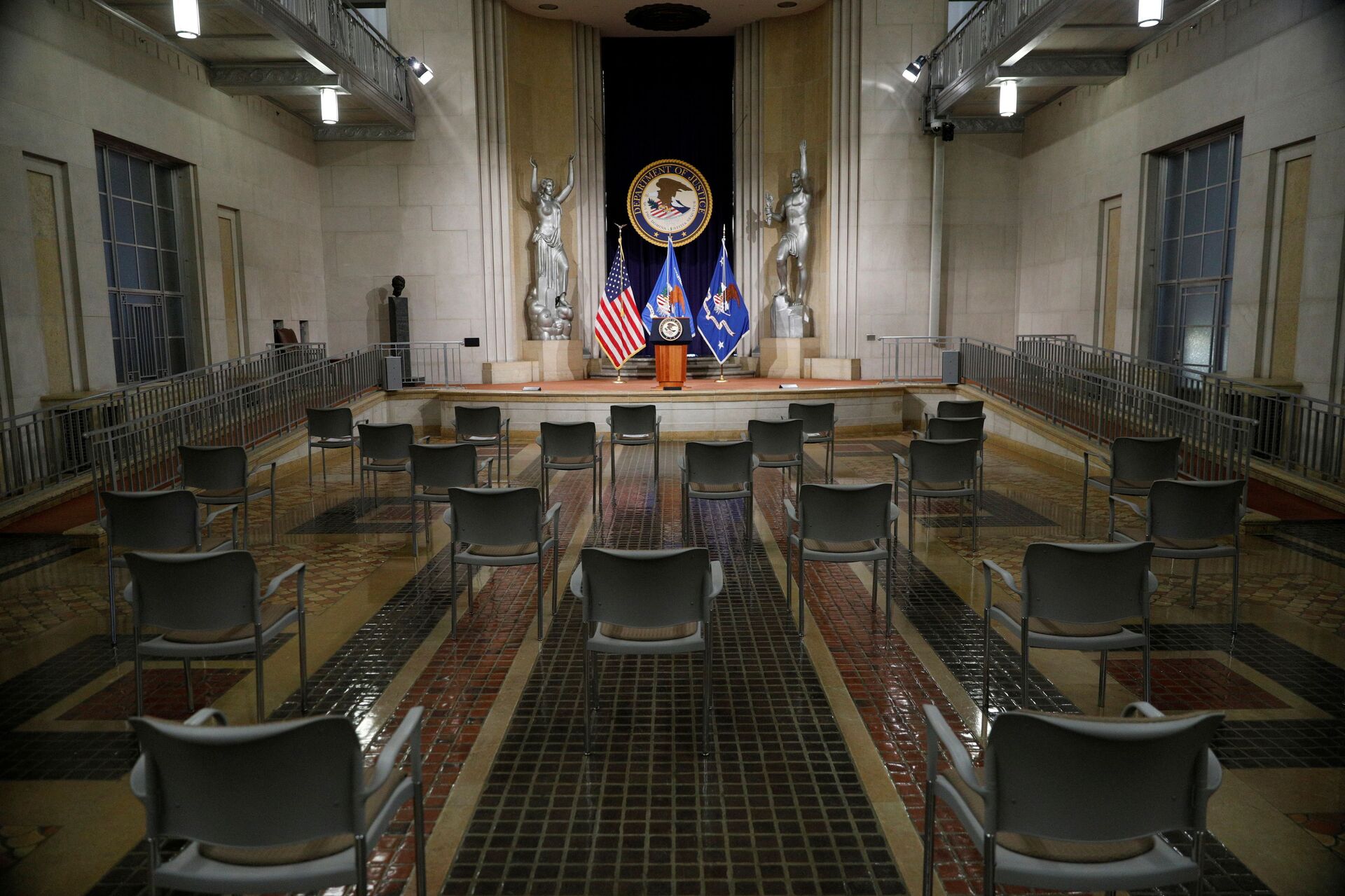 Empty chairs are arranged for social distancing, ahead of U.S. Attorney General Merrick Garland’s remarks on voting rights, inside the Great Hall at the U.S. Department of Justice in Washington, U.S., June 11, 2021. - Sputnik International, 1920, 07.09.2021