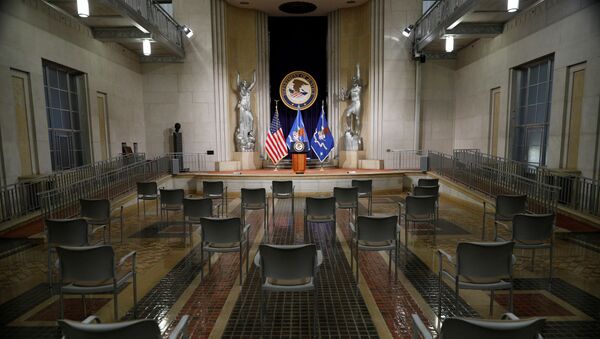 Empty chairs are arranged for social distancing, ahead of U.S. Attorney General Merrick Garland’s remarks on voting rights, inside the Great Hall at the U.S. Department of Justice in Washington, U.S., June 11, 2021. - Sputnik International