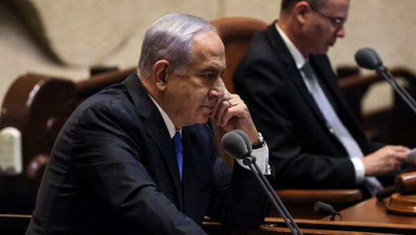 Israeli Prime Minister Benjamin Netanyahu looks on as he delivers a speech during a special session of the Knesset, Israel's parliament, whereby a confidence vote will be held to approve and swear-in a new coalition government, in Jerusalem June 13, 2021 - Sputnik International