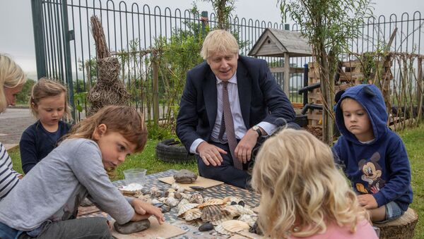 Prime Minister Boris Johnson visits the out door spaces to discuss environmental issues at the St Issey Primary school near Wadebridge in Cornwall. - Sputnik International