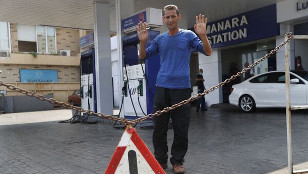 A gas station workers gestures as he saying no fuel at the station, in Beirut, Lebanon, Wednesday, July 29, 2020. - Sputnik International