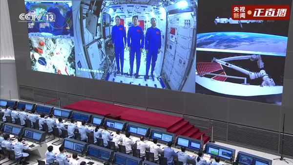 Taikonauts Liu Boming, Tang Hongbo, and Nie Haisheng speak with Chinese President Xi Jinping via high-speed internet from the Tiangong space station on June 23, 2021. Their conversation was broadcast live on China Central Television (CCTV). - Sputnik International