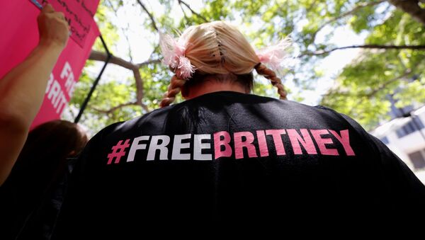 A person protests in support of pop star Britney Spears on the day of a conservatorship case hearing at Stanley Mosk Courthouse in Los Angeles, California, U.S. June 23, 2021. - Sputnik International