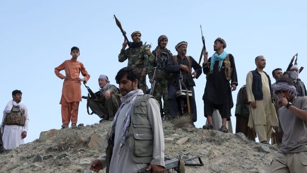 Armed men attend a gathering to announce their support for Afghan security forces and that they are ready to fight against the Taliban, on the outskirts of Kabul, Afghanistan June 23, 2021 - Sputnik International