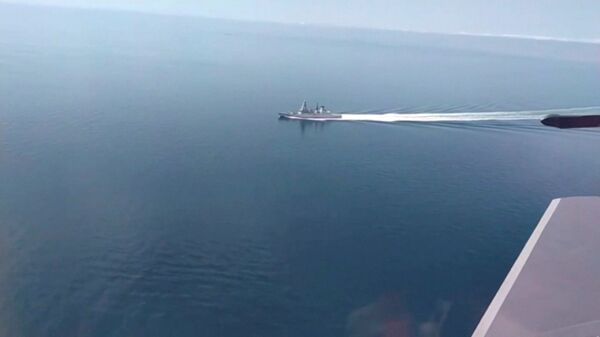 A still image taken from a video released by Russia's Defence Ministry allegedly shows British Royal Navy's Type 45 destroyer HMS Defender filmed from a Russian military aircraft in the Black Sea, June 23, 2021 - Sputnik International