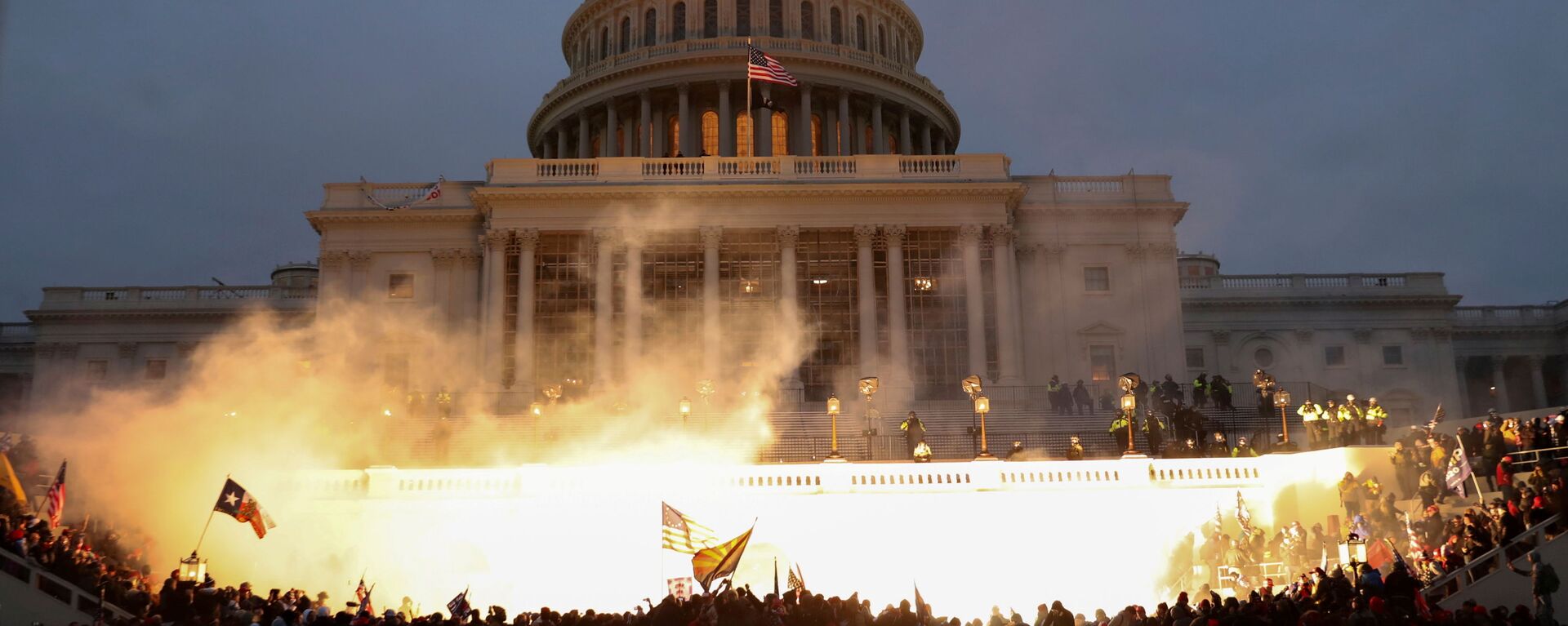An explosion caused by a police munition is seen while supporters of U.S. President Donald Trump gather in front of the U.S. Capitol Building in Washington, U.S., January 6, 2021. - Sputnik International, 1920, 25.06.2021