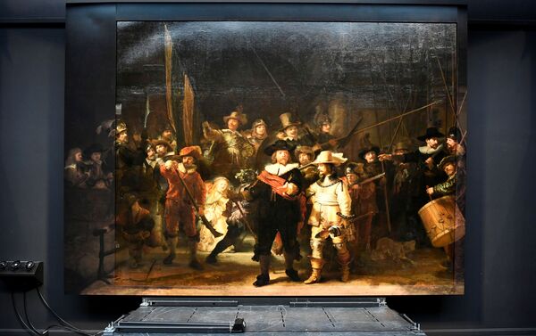 Rembrandt's famed Night Watch is seen back on display for the first time in 300 years, in what researchers say is its original size, with missing parts temporarily restored in an exhibition aided by artificial intelligence at Rijksmuseum in Amsterdam, Netherlands June 23, 2021.  - Sputnik International