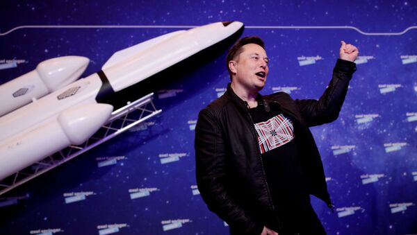 SpaceX owner and Tesla CEO Elon Musk gestures after arriving on the red carpet for the Axel Springer award, in Berlin, Germany, December 1, 2020. - Sputnik International