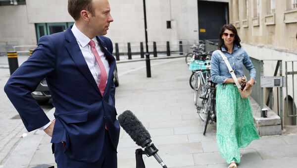 Britain's Health Secretary Matt Hancock and Gina Coladangelo stand outside the BBC headquarters in London, Britain, June 6, 2021. - Sputnik International